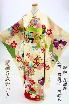 This furisode (long-sleeved kimono) is decorated with plum blossoms, cherry blossoms, and snowflakes on a cream-colored silk ground with a gauze pattern and cherry blossom ground pattern. The upper front and left breast are vividly embroidered with peony petals in pink, blue, and silver threads, making this a very gorgeous piece. Set includes Main Furisode Fukuro obi (double-breasted obi) Long underwear Obiage Obijime Kimono Furisode, length (from the shoulder peak): approx. 169.0 cm (height cannot be taken out/impossible), lintel 130.0 cm Sleeve length from the kimono: approx. 106.0 cm, lintel 108.0 cm Length from sleeve to sleeve: approx. 68.0 cm (4.0 cm from sleeve to lintel), 65.5 cm from lintel to sleeve. Front width: about 24.5cm / Back width: about 31.0cm Obi (sash) Width: approx. 3 Peony Petals, Obi Sash, Long Sleeve Kimono, Luxurious Wedding, Japanese Patterns, Plum Blossom, Japanese Kimono, Gorgeous Design, Cherry Blossoms