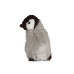 a stuffed penguin sitting on its hind legs with the words living nature written below it