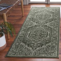 a green rug on the floor in a living room