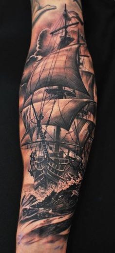 a man's arm with a ship on it