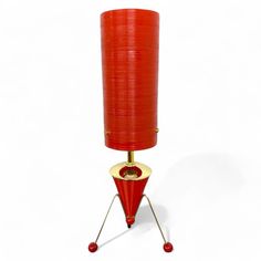 High quality Mid Century Modern style Retro Spun Fibreglass Super Atomic Sputnik Rocket Lamp. Worldwide Copyrighted Images © 2018 - 2024 Royale Enamel Ltd. All Rights Reserved. Trade Mark Registered UK00003786576 A HAND MADE PRODUCT - PRODUCED & DESPATCHED IN UNDER 2 WEEKS This is a high quality Mid Century style Retro Table Sputnik Rocket Lamp - Hand Made at our workshops in Holbeach, Lincolnshire in the UK. This beautiful Bedside, Desk, Table Lamp has the following attributes. Re Designed & made in the same way & using the same materials as similar Spun Fibreglass Lamps & Lamp Shades produced in the 1960's and 70's The lamp measures 6" wide x 6 inches Deep & stands 17 inches tall, the Spun Fibreglass Tube measures 4 inches x 9 inches high. The 4" diameter Red Spun Fibreglass tubular shad Rocket Lamp, Atomic Space Age, Bedside Desk, Retro Table, Trade Mark, Mid Century Modern Interiors, Mid Mod, Wall Plug, Desk Table