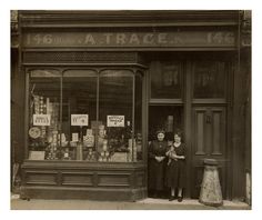 two women standing in front of a store