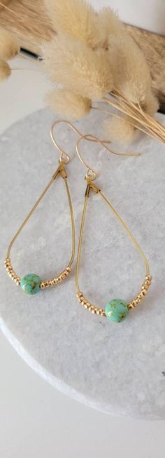 Handmade creation Earrings Creole golden drops natural turquoise green agate beads Elegant, original Very pretty piece of jewelry to treat yourself or to give as a Christmas gift, Valentine's Day, Mother's Day or any other occasion to please Find the rest of my collection on https://poamongaux.com/ Shipping takes 1 to 2 business days. The BOs are secured in a bubble envelope Other models in my wardrobe styles: #Boho #hippie #nature #chic #original #unique #ethnic #beads #silver #tassels #golden Gold Teardrop Earrings With Round Beads For Gifts, Turquoise Hoop Earrings With Dangling Beads As Gift, Turquoise Hoop Earrings With Dangling Beads For Gifts, Gold Teardrop Beaded Earrings, Turquoise Teardrop Brass Jewelry, Everyday Teardrop Jewelry With Dangling Beads, Mon Dressing, Drop Hoop Earrings, Vert Turquoise