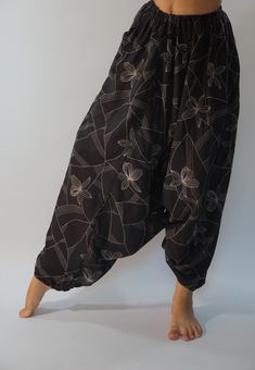 "These super soft rayon baggy unisex harem pants have the \"flow\", perfect of yoga or just a cool strolling. Comfort and character are what these pants are all about. They have the traditional sarong look & feel but a lot more practical when it comes to activity like yoga. As a bonus, they are convertible! Just pull them up and you get yourself a cute jumpsuit in a flash. Together with elastic cuff legs, you can wear them short or long. The pants have smock waist (wide bang elastic) with no Comfortable Baggy Harem Pants For Yoga, Relaxed Fit Harem Pants For Yoga, Baggy Harem Pants For Meditation, Sarouel Pants, Cute Jumpsuit, Cotton Harem Pants, Maxi Pants, Yoga Trousers, Harem Pants Women