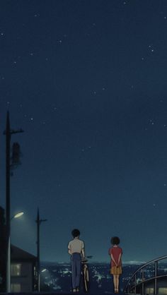 two people looking at the stars in the night sky