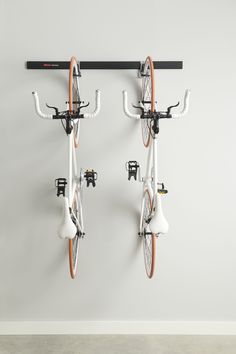 Rubbermaid FastTrack bike kit is a great way to organize your bikes within the garage. Get bikes off the floor and onto the wall, creating more space to work and play. Rubbermaid FastTrack Garage 3-Piece Black and Satin Nickel Steel Bike Rack | 2087463 Bike Rack Apartment, Bike Wall Mount Apartment, Bike Storage Flat, Apartment Bike Storage, Garage Organization Bikes, Bike Storage Small Space, Metal Garage Storage Cabinets, Vertical Bike Storage, Bike Concept