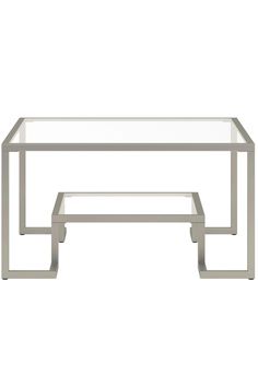 a glass and metal coffee table on a white background