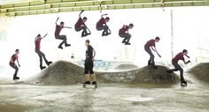 a group of skateboarders doing tricks in an indoor area with graffiti on the walls