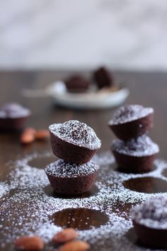 chocolate cupcakes with powdered sugar on top