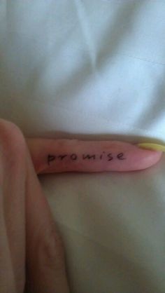 someone has written the word prom on their arm and is laying in bed with white sheets