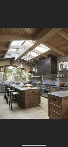 an instagram photo of a kitchen with wooden cabinets