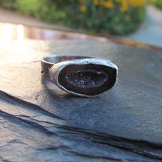 "Silver Druzy Geode Ring Sparkling Geode Ring Silver Sparkly Red Black Druzy Ring: A stunning, one-of-a-kind, handmade stackable ring featuring a natural sparkling druzy geode set in silver. The geode is black, red and gray and it measures 11/16\" by 7/16\". Band is a little over 3/16\" wide. The ring itself is a size 7. Completely handmade by myself. Enter my shop: https://www.etsy.com/shop/artdi Join me on Facebook: https://www.facebook.com/Artdi-Diana-Anton-Jewelry-Design-44805607932/ Find me Silver Crystal Promise Ring With Stones, Silver Open Ring Halo With Gemstone, Silver Halo Ring With Gemstone And Open Design, Silver Open Halo Ring With Gemstone, Silver Gemstone Ring With Open Band, Silver Open Band Ring With Gemstone, Large Stone Promise Ring, Silver Ring With Large Stone, Silver Oval Rings With Stones