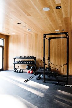 an empty gym room with several exercise equipment