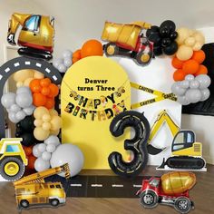 construction themed birthday party with balloons and decorations