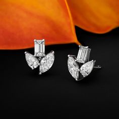 Revel in the allure of our Multi-Shape Diamond Stud Earrings, a testament to versatility and luxury. Meticulously crafted, these earrings feature a captivating array of diamond shapes. Luxury Silver Diamond Earrings In Fusion Style, Luxury Cluster White Gold Diamond Earrings, Luxury Platinum Baguette Cut Earrings, Luxury White Gold Baguette Cut Earrings, Marquise Brilliant Cut Diamond Earrings For Evening, Luxury White Gold Pear-shaped Cluster Earrings, Luxury Pear-shaped White Gold Cluster Earrings, Luxury Platinum Cluster Earrings In Diamond White, Luxury Diamond White Platinum Cluster Earrings