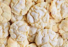 a pile of cookies that are covered in powdered sugar