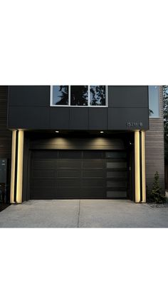 an image of a modern garage with lights on the front and side doors in black