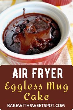 an eggless mug cake in a bowl with the words air fryer eggless mug cake