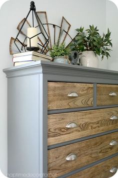 a dresser with some books on top of it