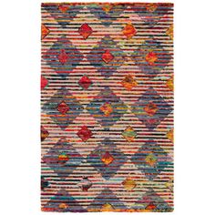 a multicolored rug with an abstract design