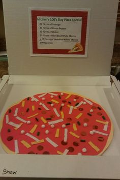 a pizza with sprinkles on it in a box