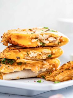 a stack of food sitting on top of a white plate