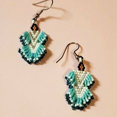 Dangle Earrings  🌷 Made by the artist: Unknown  EARRINGS Beadwork  Hooks Handmade Native Beadwork Earrings, Traditional Dangle Jewelry With Bead Caps, Handmade Traditional Turquoise Beaded Earrings, Bohemian Drop Earrings With Bead Caps, Adjustable Bohemian Earrings With Bead Caps, Traditional Turquoise Beaded Earrings For Festivals, Bohemian Dangle Jewelry With Bead Caps, Green Bohemian Earrings With Bead Caps, Traditional Turquoise Teardrop Beaded Earrings