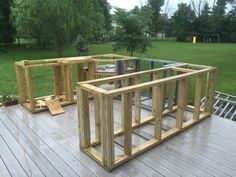 two wooden frames sitting on top of a deck