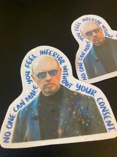 two stickers depicting the face of an older man with sunglasses on, one is wearing blue