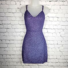 Nwt Purple Glitter Lace-Up Mini Dress - Large Color: Purple / Slate Size: Large Perfect For Homecoming, Birthday Party, Cocktail Party, Holiday Party, Date Night, Girl's Night Out, And Many More! Look Stunning In This Glitter Mini-Dress! Featuring A Classic Sleeveless V-Neck, Spaghetti Straps, And A Flattering Bodycon Silhouette And Lace-Up Back For The Perfect Fit. Sleeveless V-Neckline Spaghetti Straps, Lace Up Back Bodycon Silhouette Mini-Length Hem Glitter Knit Fabric Moderate Stretch 95% Po Red Hoco Dress, Red Hoco, Glitter Mini Dress, Mini Prom Dresses, Hoco Dress, Windsor Dresses, Purple Glitter, Hoco Dresses, Girls Night Out