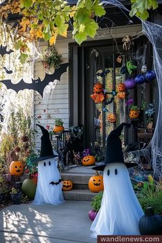 halloween decorations on the front steps of a house