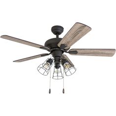 a ceiling fan with three light bulbs and caged glass shades on the blade blades