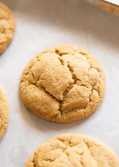 freshly baked cookies sitting on a baking sheet