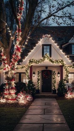 a house decorated with christmas lights and decorations