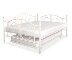 a white metal bed frame with two mattresses