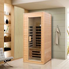 a sauna is shown in the middle of a room with shelves and chairs around it