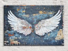 "ETHEREAL BEAUTY!! Created or curated by the artist RYAN JAMES. Elevate your space with the colorful charm of graffiti angel wings depicted in this dynamic canvas print, capturing the essence of street culture and urban artistry. QUALITY: This canvas is a high-quality reproduction of the artist's original work. Printed on high quality, artist grade stock and folded around a lightweight 1.25\" thick Wooden frame to give them a gorgeous, gallery ready appearance. With acid free ink that will last Brick Wall Art, Street Culture, Ethereal Beauty, Artist Canvas, Banksy, Brick Wall, Original Work, Angel Wings, Wooden Frame