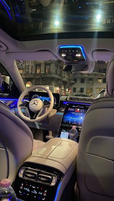 the interior of a car with many electronic devices in it's dash lights and steering wheel