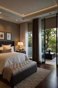 a bedroom with a large bed sitting next to a sliding glass door