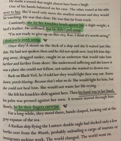 an open book with green marker writing on the page and two other words in it