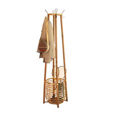 a coat rack with two umbrellas hanging from it's sides and an umbrella holder on the other side