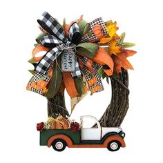 an orange and black truck with a bow on it