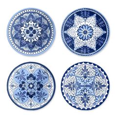 four blue and white plates with designs on them