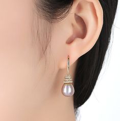 Enhance your natural glow with the right kind of luster, through the splendor of real pearl earrings. Less is definitely more when it comes to these dainty, yet utterly radiant white pearl drop earrings that capture the light from every angle. Measuring 10mm, the Freshwater pearl earrings are the ideal jewelry piece to compliment your wardrobe. our earrings come in fine settings: 14K yellow gold. * Buy over 2 pieces and get a medium jewelry organizer * Buy over $100 and get a large mirror jewelr Fine Jewelry Rose Gold Pearl Drop Earrings, Rose Gold Pearl Drop Earrings Fine Jewelry, Formal Rose Gold Pear-shaped Pearl Earrings, Rose Gold Single Pearl Earring, Round, Elegant Rose Gold Akoya Pearl Earrings, Single Pear-shaped Pearl Earring For Formal Occasions, Elegant Rose Gold Pear-shaped Pearl Earrings, Formal Single Pear-shaped Pearl Earring, Rose Gold Pearl Charm Earrings