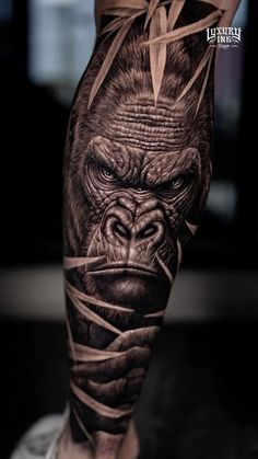 a man's leg with a gorilla tattoo on it