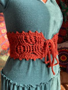 The Harvest Corset belt is the perfect addition for any cottagecore lover🌿 Featuring a wheat stitch, these belts are made with an acrylic yarn for an extra bit of stretchiness. The corset style lacing allows you to cinch the belt to your figure. These belts are ready to ship, and each one is a different size, so follow the measurements below for more details.  The Harvest Corset belt can also be found Made to Order from sizes XS-4X in 6 different colors💕 MEASUREMENTS  TAN: size Medium Fits 30.5- inch waists  Length end to end (when stretched taught): 30 inches Length top to bottom (including picot edging): 7 inches . . BROWN: size Large Fits 33.5 inch waists Length end to end (when stretched taught): 33 inches Length top to bottom (including picot edging): 7 inches . . ORANGE: size XLarg Crochet Waist Belt, Witch Corset, Wheat Stitch, Belt Crochet, Corset Etsy, Cottagecore Corset, Garden Witch, Crochet Costumes, Crochet Belt