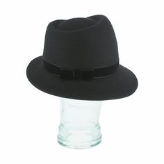 The Italian-made Belfry Zita, with its chic silhouette and charismatic allure, will make a bold statement with any ensemble. This women's trilby features an asymmetrical brim with a velvet hat band trimmed with a gold chain clasp for an elegant touch. Additionally, the inner band offers an adjustable drawstring for customizable fit, ensuring utmost comfort for day-to-day wear. With a reliable wool felt body sure to hold its shape wear after wear, don the Zita and elevate your style with distinct Chic Wide Brim Fitted Fedora, Modern Fitted Fedora With Flat Brim, Chic Fitted Felt Hat With Flat Brim, Chic Fitted Brimmed Fedora, Chic Fitted Fedora With Brim, Chic Fall Fedora, Chic Fitted Fedora For Fall, Spring Classic Fitted Felt Hat, Formal Brimmed Fedora