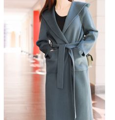 Product Description: handmade Cashmere coat high grade fabric,cashmere fabric.also could be custom made with any size and other colors,please feel free to contact with me if you want custom it. Material: cashmere 100% Size: S: Bust : 112 cm shoulder and Sleeve:70cm Length:105cm M: Bust : 116 cm shoulder and Sleeve:71cm Length:105cm L: Bust : 122cm shoulder and Sleeve:72cm Length:105cm XL: Bust : 126cm shoulder and Sleeve:73cm Length:105cm Shipping we ship worldwide the USPS takes about 15 days a Women Wool Coat, Black Waist Belt, Coat With Hood, Cashmere Fabric, Cashmere Coat, Wool Coat, Waist Belt, High Grade, Duster Coat