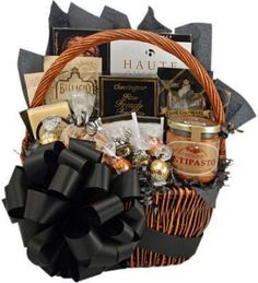 a gift basket filled with chocolates, nuts and other items for someone's special occasion