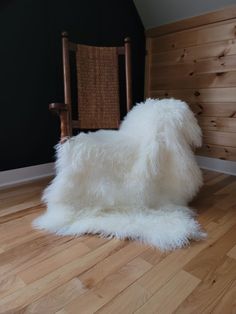 Mongolian 3-pelt sheepskin throw shown on rocking chair with a black batten wall on hickory wood floor Grey Sheepskin Rug, Large Sheepskin Rug, White Sheepskin Rug, Anti Slip Mat, Sheepskin Chair, Autumn Interior, Sheepskin Rugs, White Throw Blanket, Sheepskin Throw